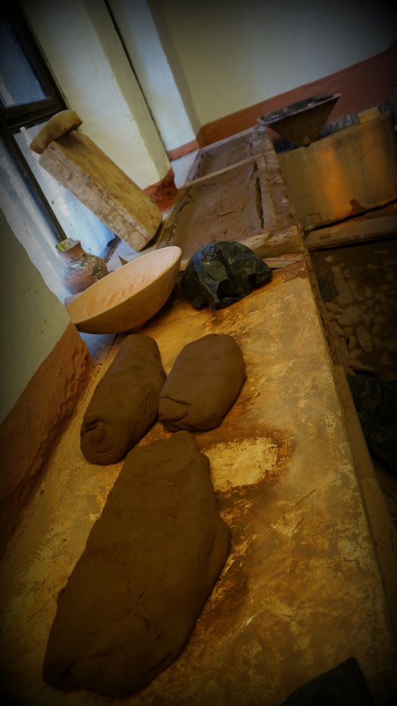 From lumps of raw clay brought in from the surrounding areas, he creates this workable clay.